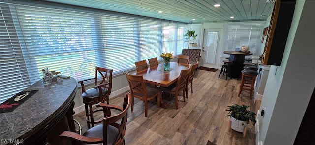 dining space with a wealth of natural light, recessed lighting, and wood finished floors