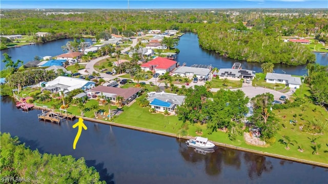 drone / aerial view featuring a water view and a residential view