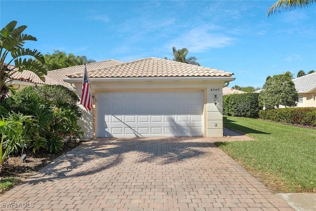 garage featuring decorative driveway