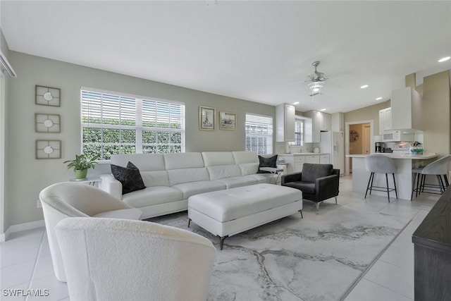 living room with recessed lighting, baseboards, and ceiling fan