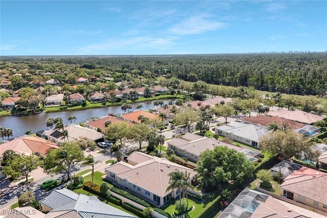 bird's eye view featuring a water view and a residential view