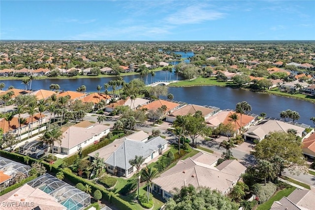 aerial view with a residential view and a water view