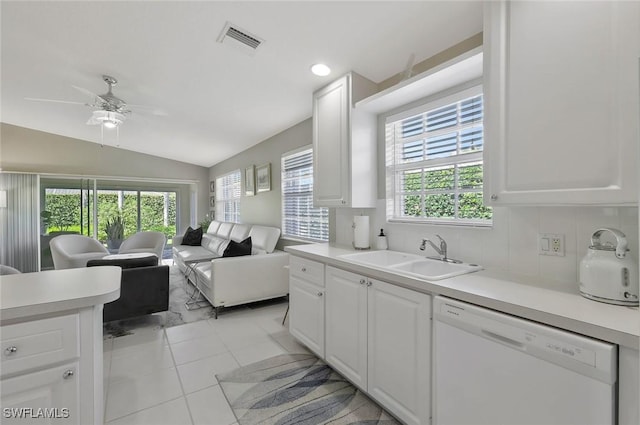 kitchen featuring visible vents, dishwasher, open floor plan, light countertops, and a sink