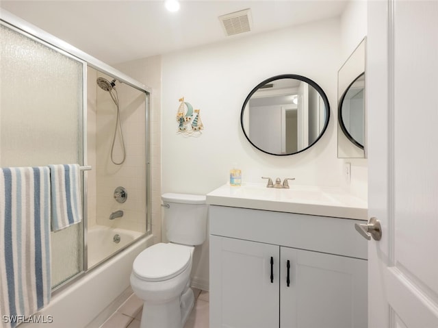 full bath with toilet, visible vents, bath / shower combo with glass door, and vanity