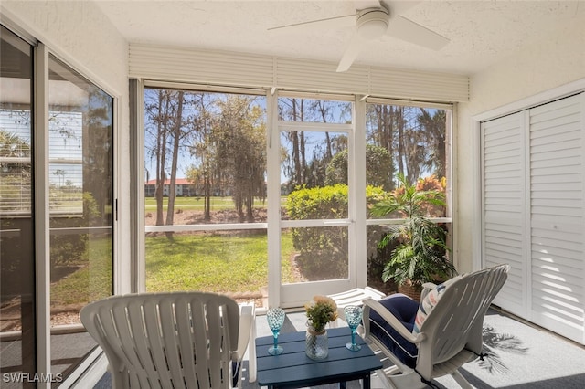 sunroom with ceiling fan and plenty of natural light