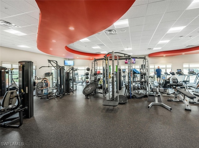 exercise room featuring a paneled ceiling and visible vents