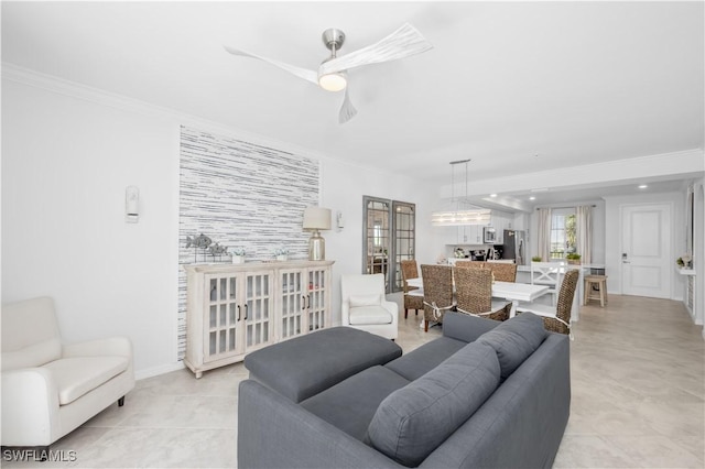 living room featuring crown molding and ceiling fan
