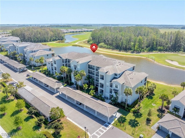 drone / aerial view featuring a water view and view of golf course