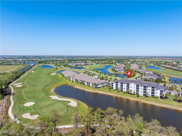 drone / aerial view featuring a water view and view of golf course