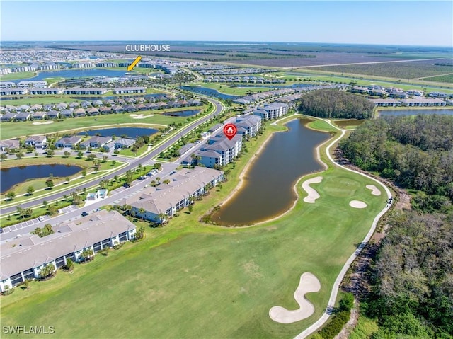 bird's eye view featuring golf course view and a water view
