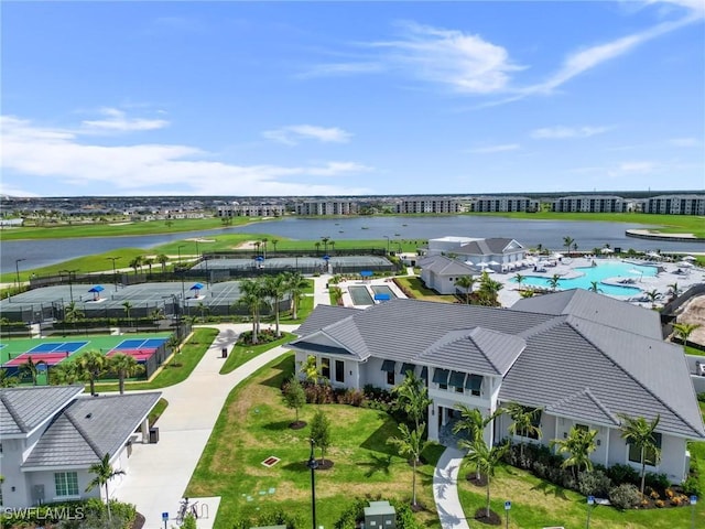 birds eye view of property with a water view