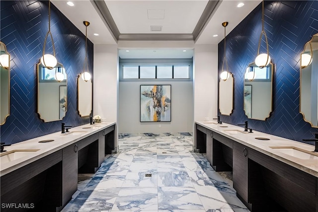 bathroom featuring a sink and marble finish floor