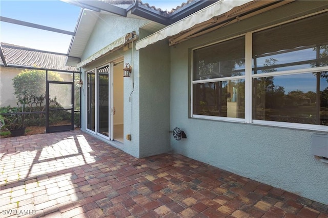 view of patio with a lanai