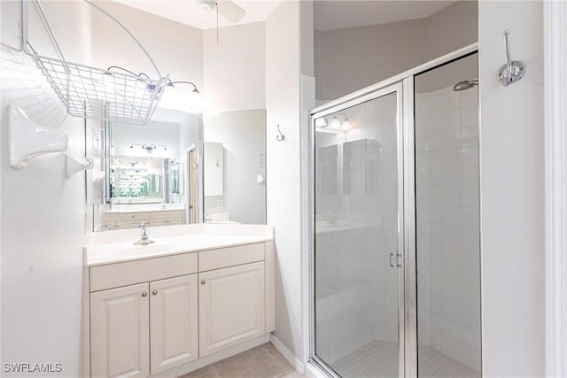 bathroom with vanity and a shower stall