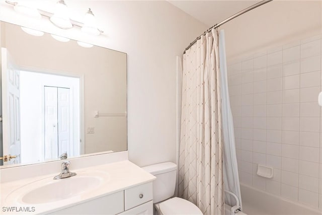 bathroom featuring vanity, toilet, and shower / bath combo