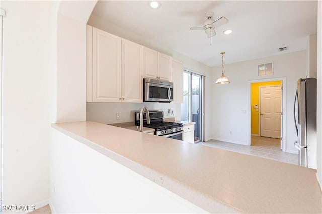 kitchen featuring a ceiling fan, visible vents, recessed lighting, stainless steel appliances, and light countertops