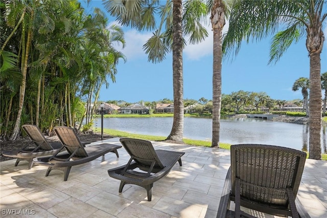 view of patio with a water view