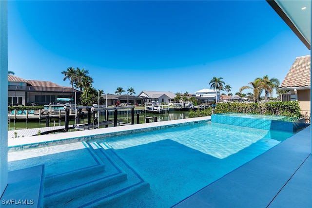 view of pool with a boat dock, a water view, and a residential view