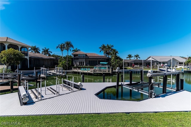 dock area featuring a residential view, a water view, and boat lift