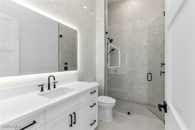 full bath featuring tile patterned flooring, a shower stall, toilet, and vanity