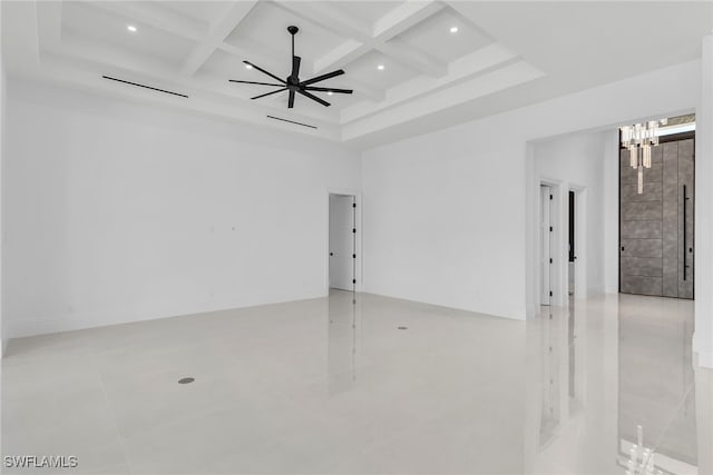 unfurnished room featuring a ceiling fan, beam ceiling, coffered ceiling, and a high ceiling