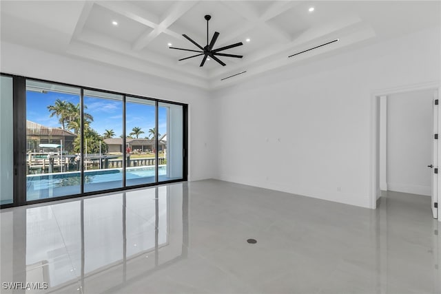 spare room with beam ceiling, recessed lighting, a towering ceiling, coffered ceiling, and baseboards