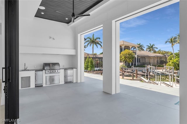 view of patio with a sink, ceiling fan, grilling area, and area for grilling