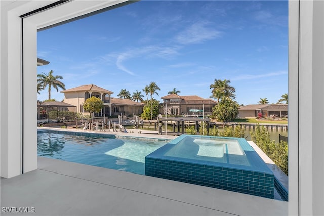 view of pool with a patio area and a residential view