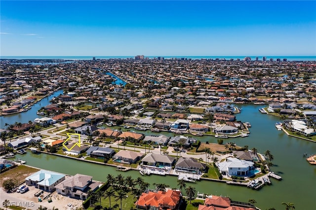 bird's eye view featuring a water view and a residential view