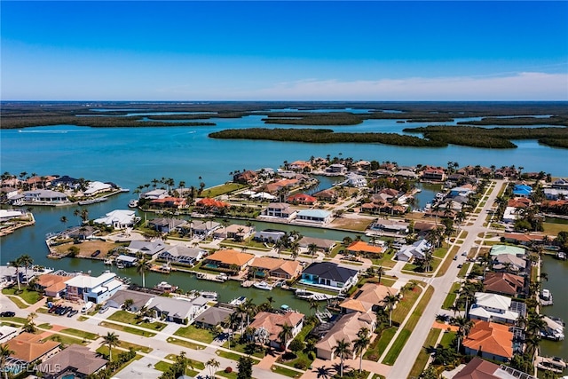 aerial view with a water view and a residential view