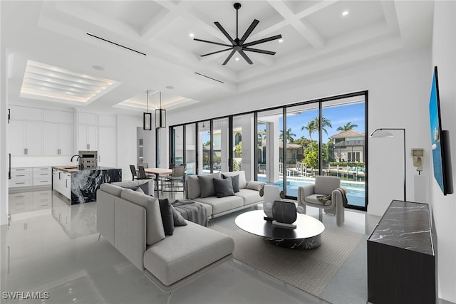 living area with a high ceiling, coffered ceiling, beam ceiling, and recessed lighting