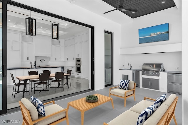 living area featuring ceiling fan and concrete floors