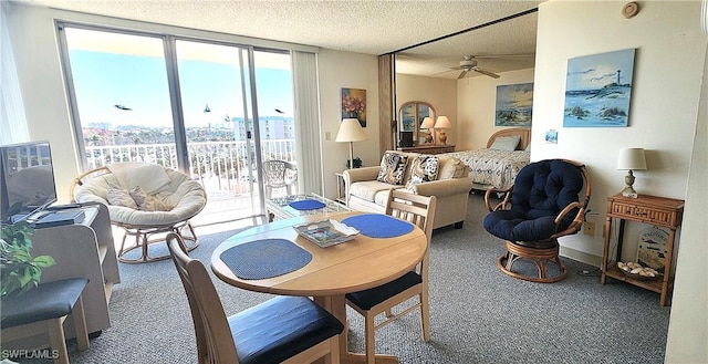 dining area featuring carpet, a ceiling fan, and a textured ceiling