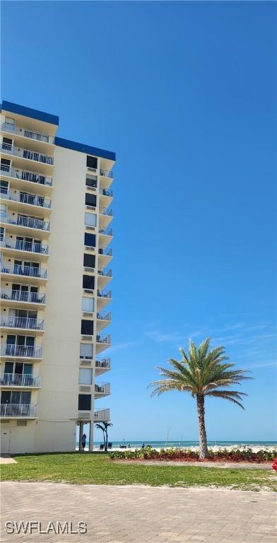 view of property featuring a water view and a view of the beach