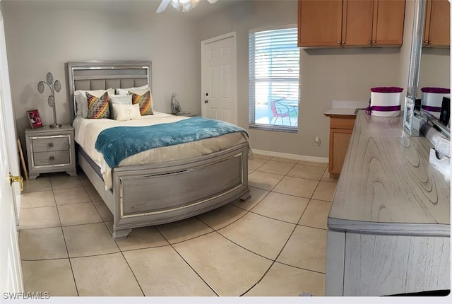 bedroom featuring light tile patterned floors and baseboards