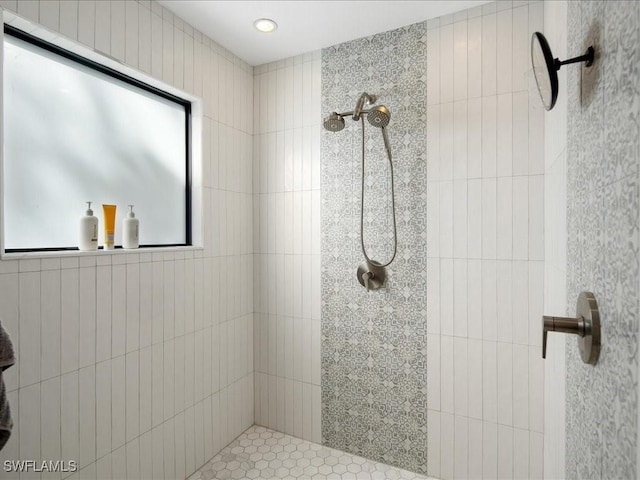 full bath featuring tiled shower