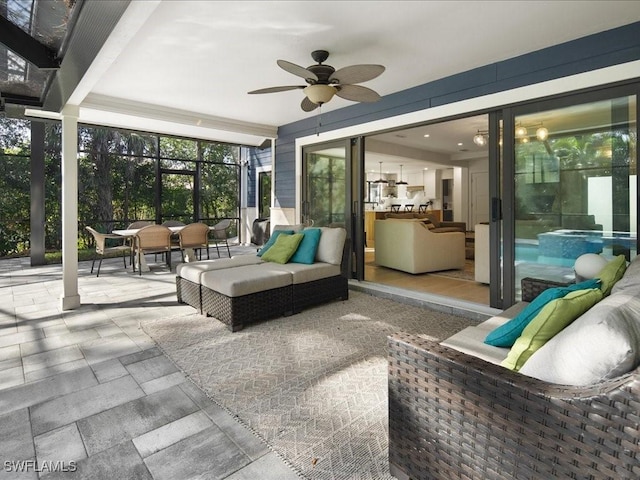 sunroom / solarium with a ceiling fan