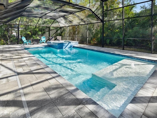 view of swimming pool with a pool with connected hot tub, a patio area, and a lanai