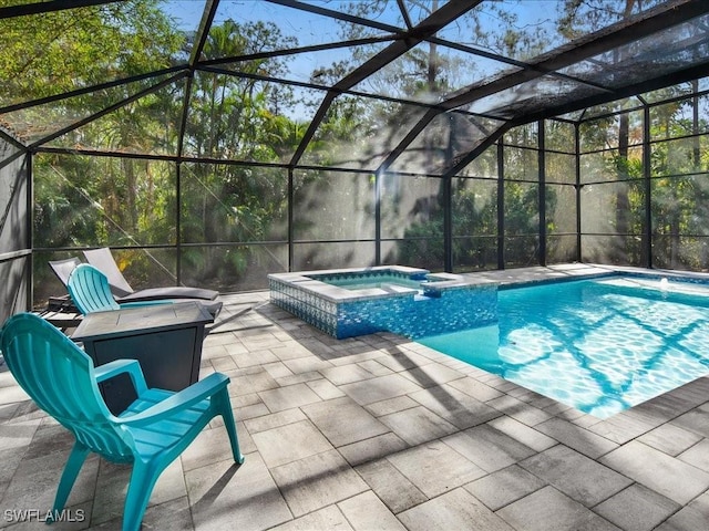 view of swimming pool with a patio area, a lanai, and a pool with connected hot tub