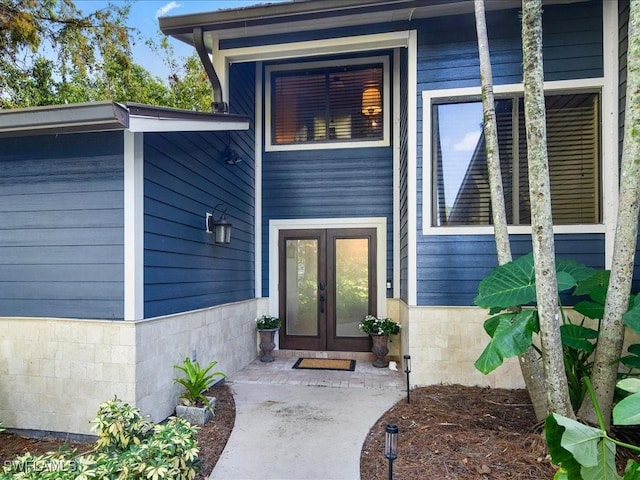 property entrance featuring french doors