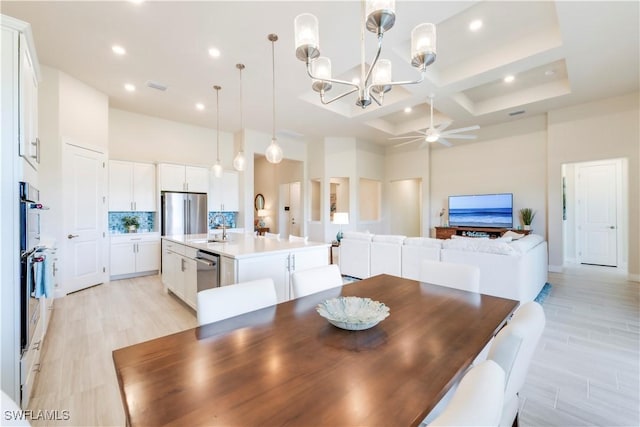 dining room with visible vents, ceiling fan, recessed lighting, a towering ceiling, and coffered ceiling