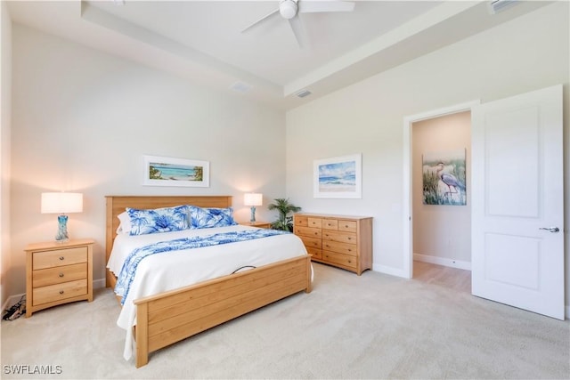 bedroom featuring a ceiling fan, baseboards, visible vents, and light carpet