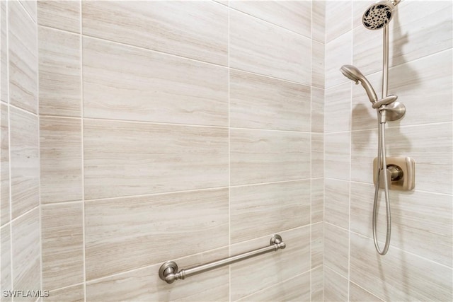 bathroom with a tile shower