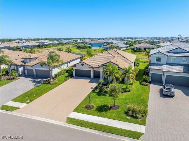 birds eye view of property with a residential view