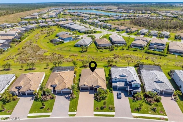 bird's eye view with a residential view and a water view