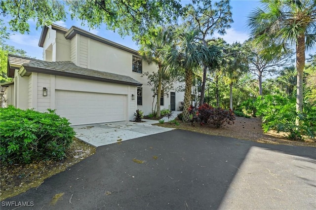 view of front of house with aphalt driveway