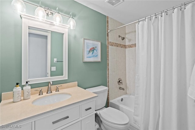 bathroom featuring vanity, shower / bath combo with shower curtain, toilet, and visible vents