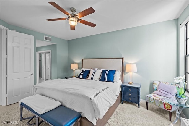 bedroom with a ceiling fan and visible vents