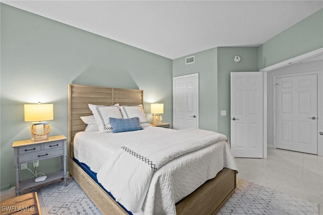 tiled bedroom with visible vents