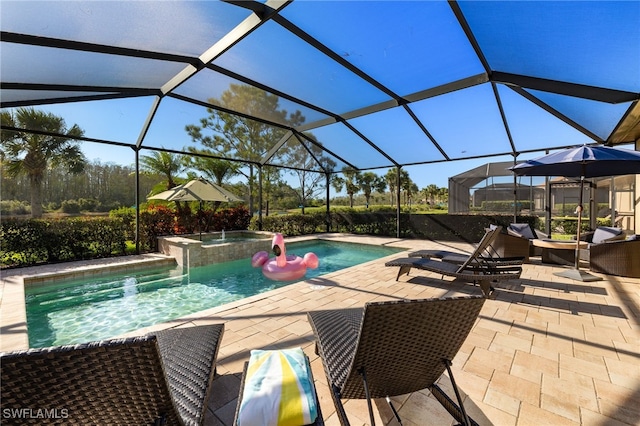 view of swimming pool with a pool with connected hot tub and a patio